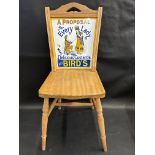 An older reproduction advertising chair with enamel back for Bird's Custard, made by Relic Designs