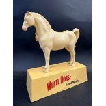 A White Horse Scotch Whisky plastic advertising figure, 9 1/4" w.