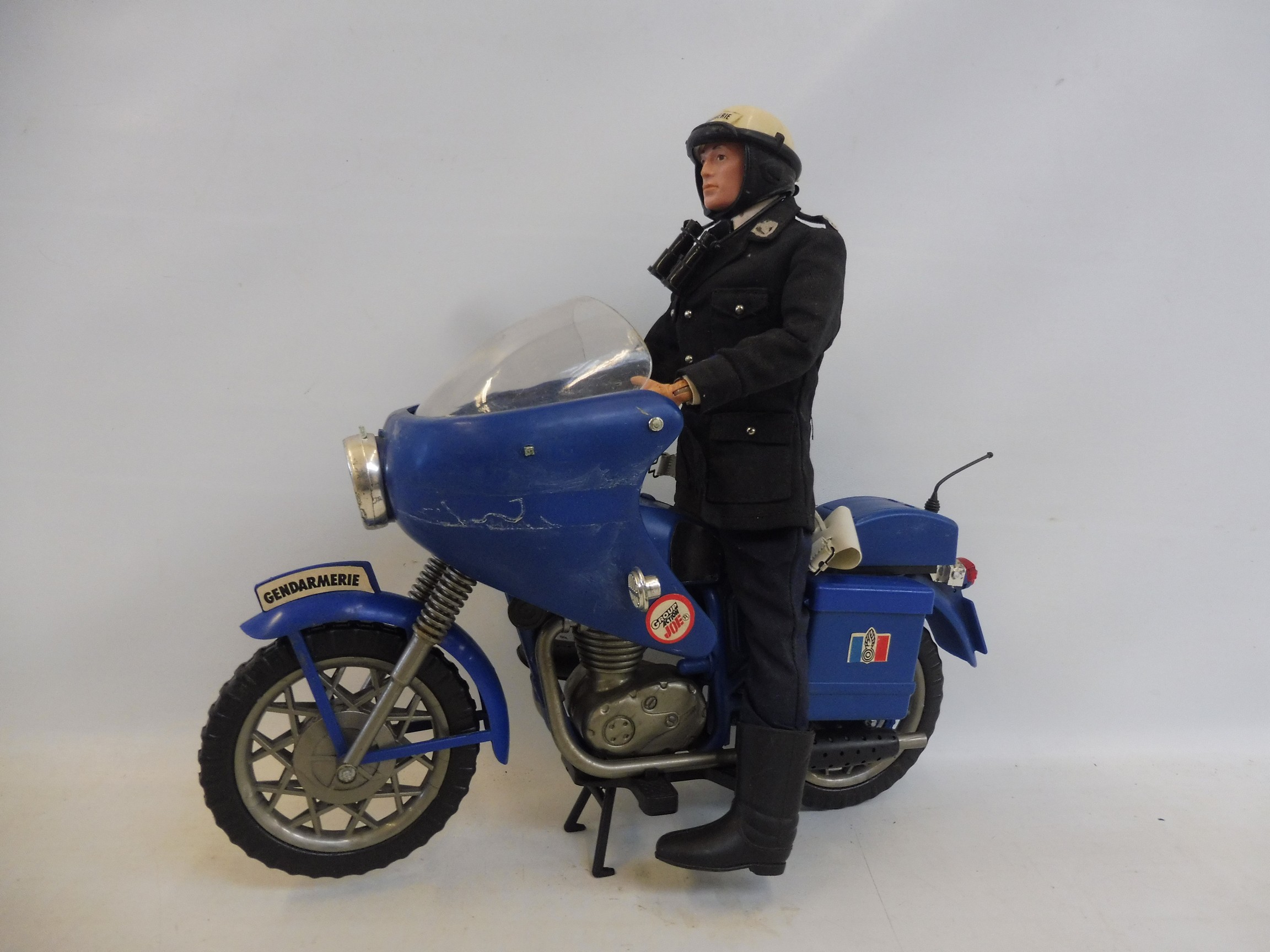 A rare Action Joe Gendarmerie motorbike and figure, complete with accessories.