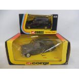 Two boxed Corgi Toys die-cast taxis.