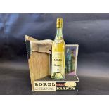 A die-cut and 3D showcard advertising Lorel Brandy, 9 3/4 x 14 1/2".