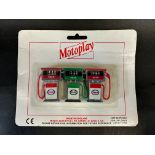 A Motoplay set of three petrol pumps on original card, Made in England.
