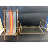 A brass dolls' bed frame with sprung base, plus a dolls' deckchair.