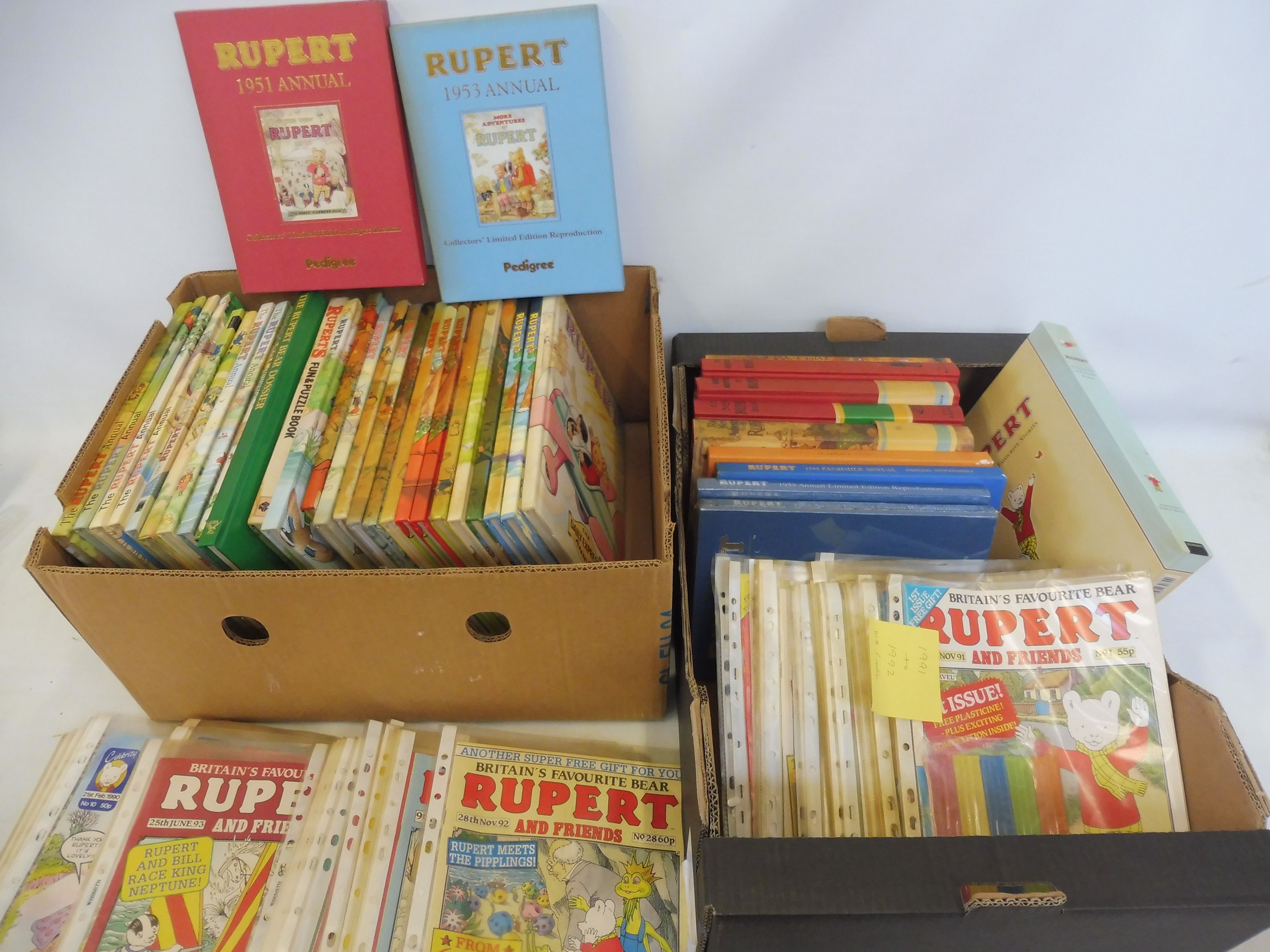 Two boxes of Rupert annuals, comics, different eras.