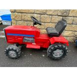 A fairground ride in the form of tractor.