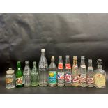 A selection of glass bottles, some for drinks including Pepsi-Cola, 7up etc. plus two pharmacy