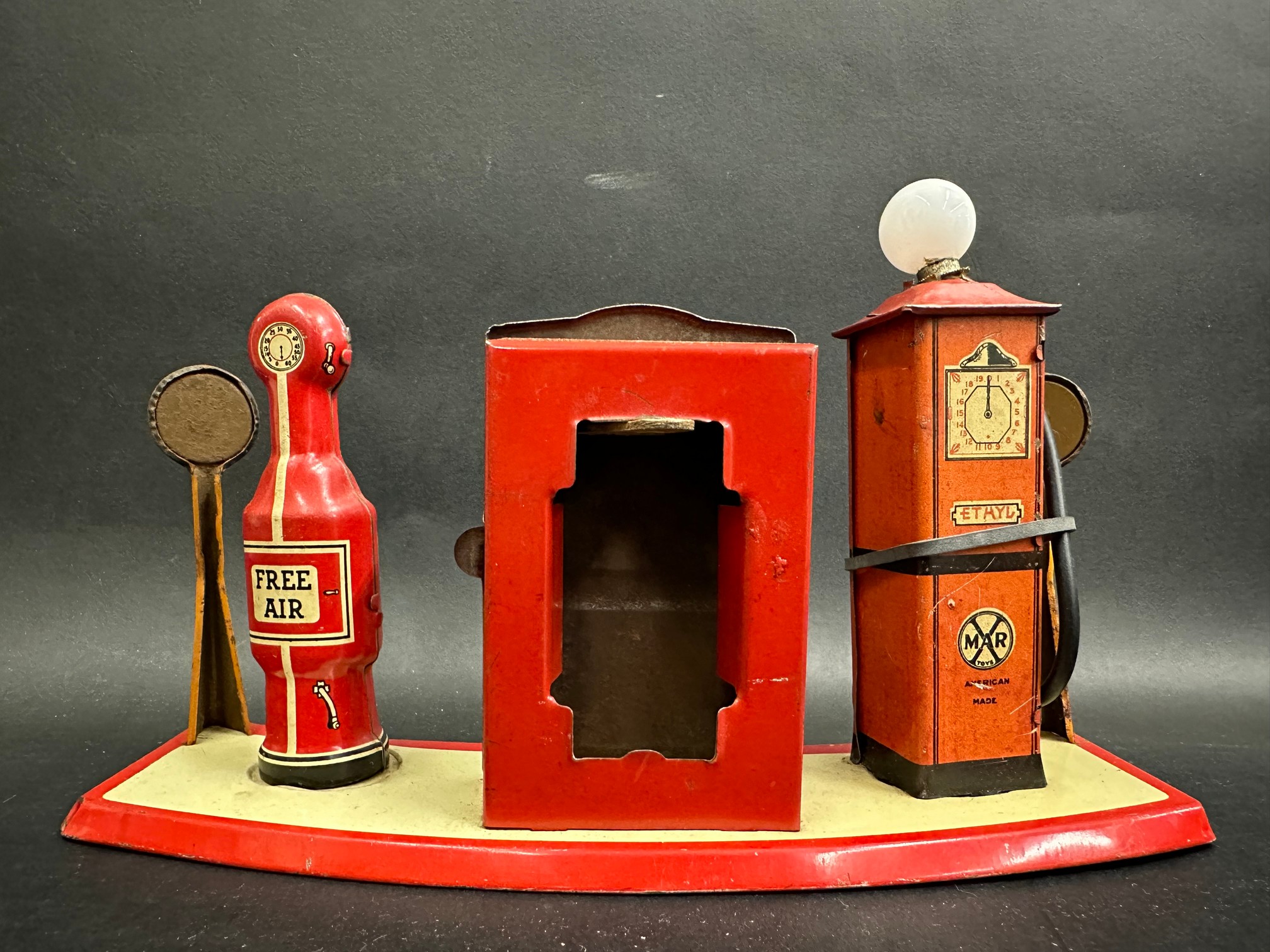 A Marx tinplate petrol filling station, with two petrol pumps flanking a central oil cabinet. - Image 2 of 2