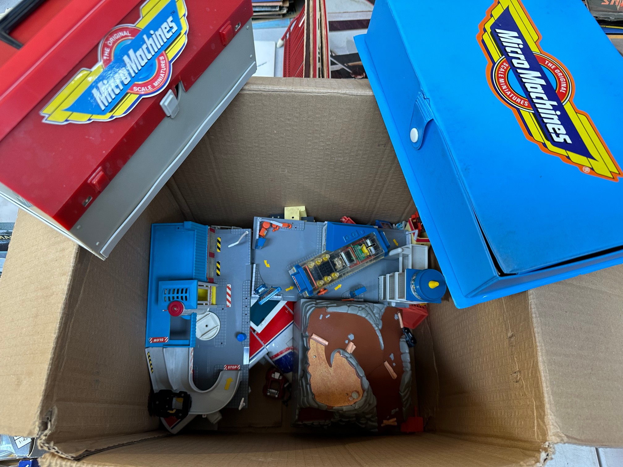 A box of Micro Machines, various genres.