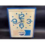 A circa 1980s wall clock advertising Pepsi, 13 1/2" w x 16" h x 5 1/2" d.