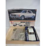 A boxed Doyusha 1:12 scale Mercedes Benz 450, contents appear to be part built and unchecked.