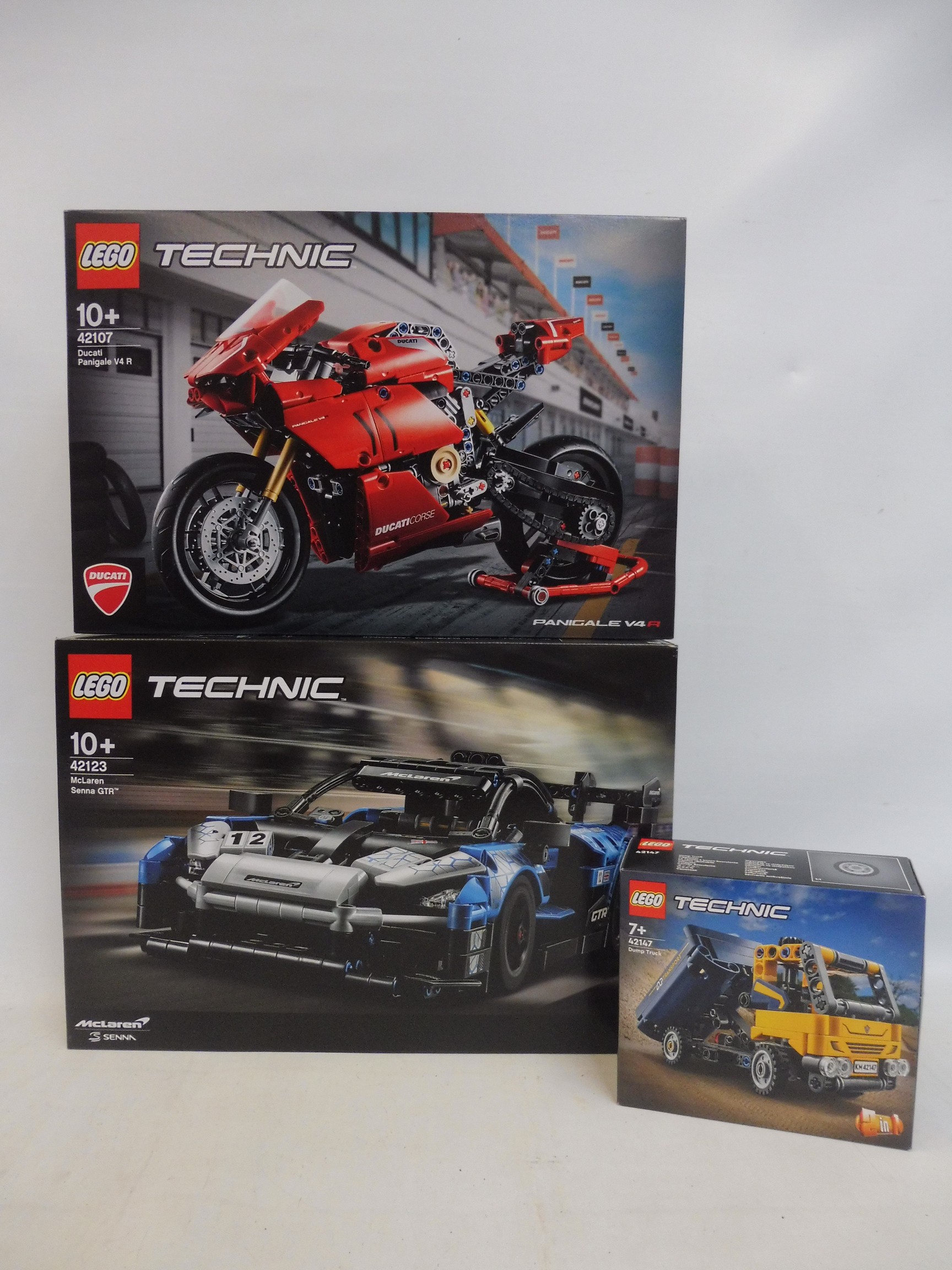 Three unopened boxed sets, Technic Ducati no. 42107, Technic McLaren Senna GTR, no. 42123 and a