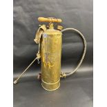 A polished brass sprayer, made by The Four Oaks Spraying Machine Co. Ltd, 24" h.