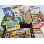 Three boxes of assorted jigsaw puzzles including some tv-related, various ages.
