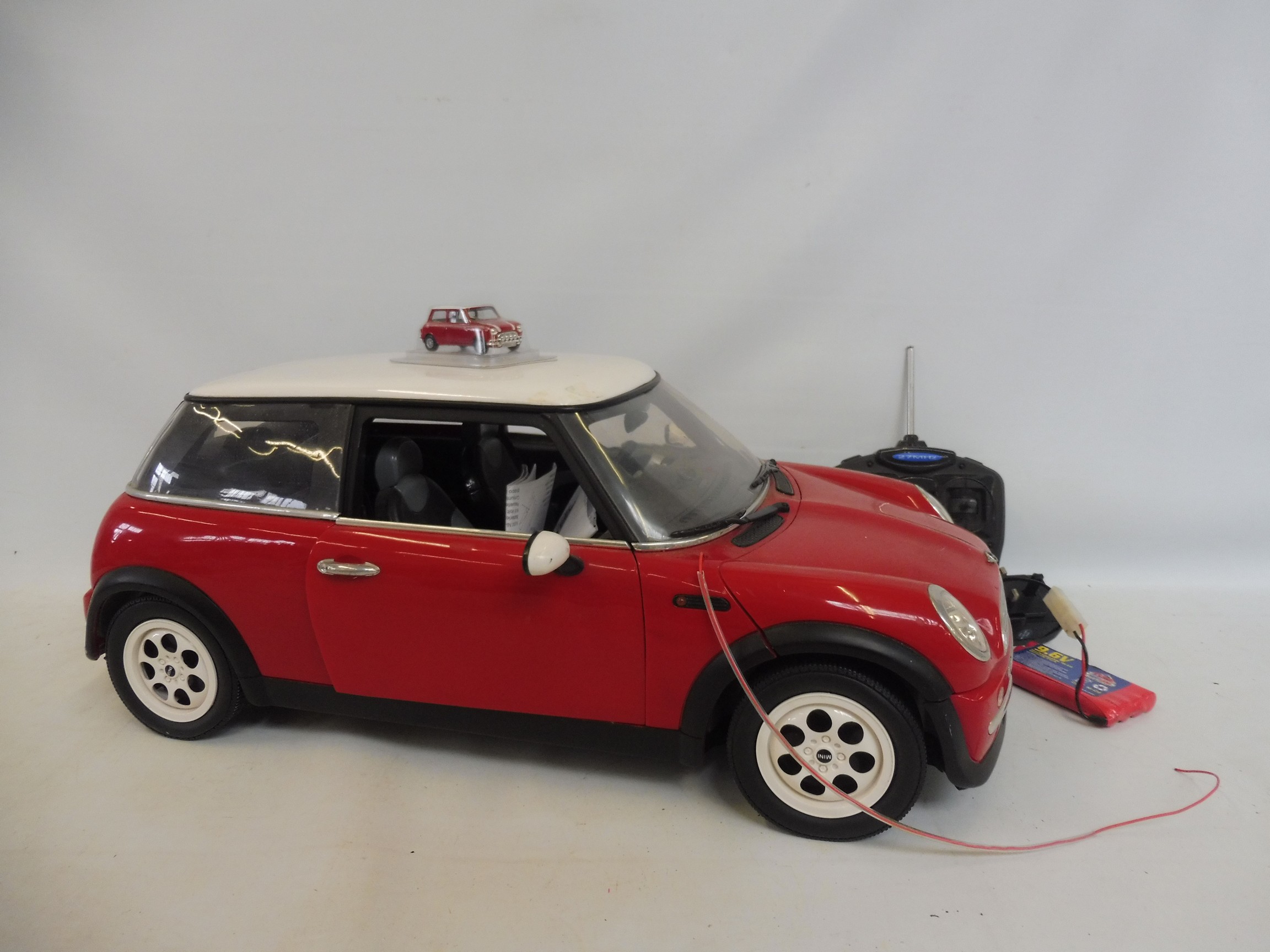 A remote controlled Mini Cooper, with instructions, unchecked.