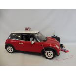 A remote controlled Mini Cooper, with instructions, unchecked.