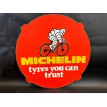 A Michelin 'Tyres You Can Trust' pictorial hardboard advertising sign, 25" diameter.