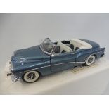 A Danbury Franklin Mint 1:24 scale die-cast model - Buick Skylark 1953 metallic blue in box.