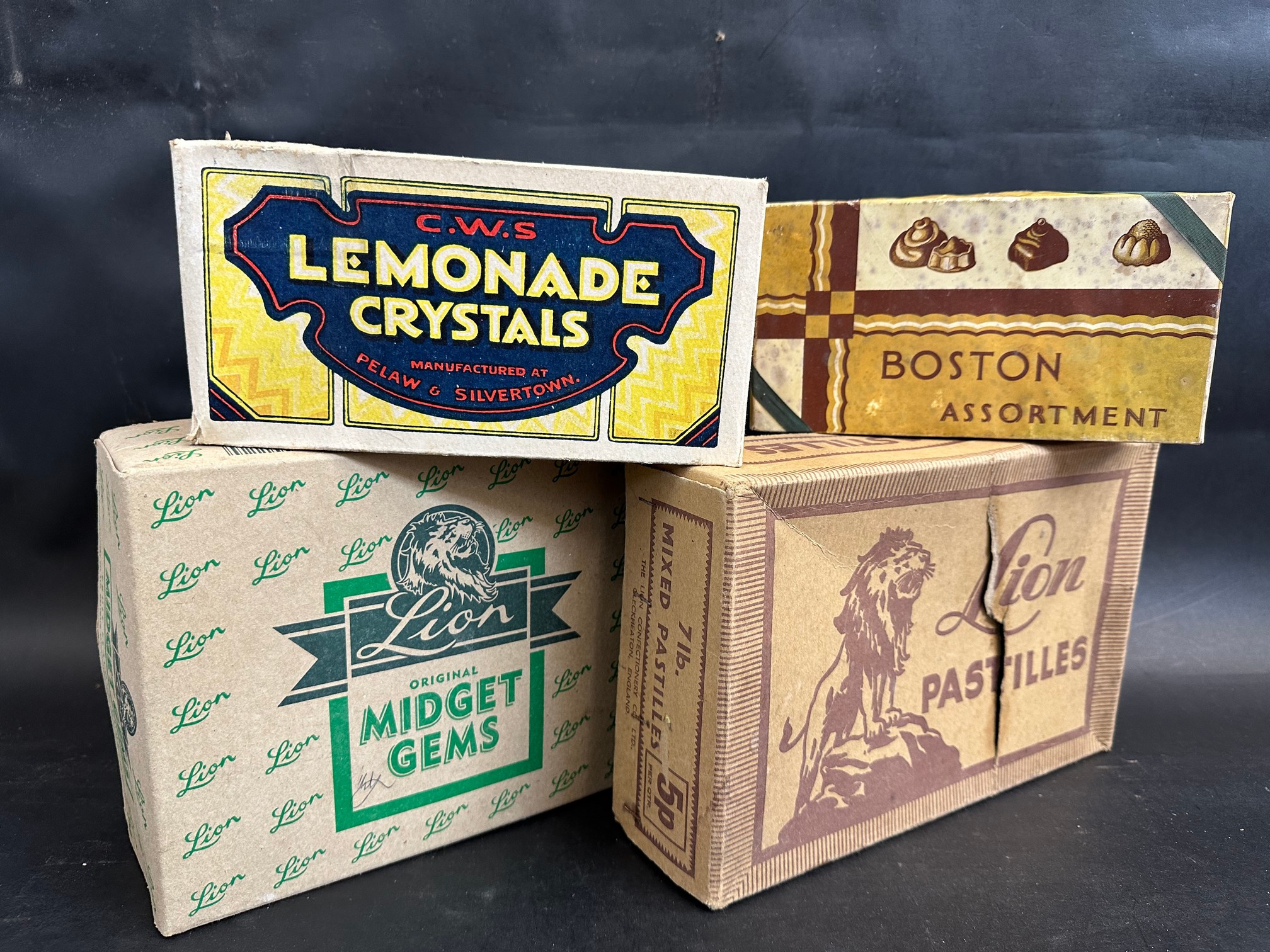 A Lion Midget Gems cardboard dispensing box, another for Lion Pastilles, a box for C.W.S. Lemonade