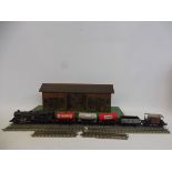An early tinplate railway station with images of pre-war cars, to suit OO gauge layout plus a