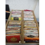 A large quantity of predominantly 1960s singles in VG+ condition, with sleeves, many different bands