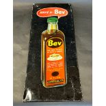 A rectangular tin sign advertising Bev Essence of Coffee and Chicory, 9 x 24 1/2".
