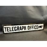 A rectangular enamel sign in excellent condition, 'Telegraph Office' with pointing hand, 31 x 6".