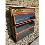 An Edwardian shop dispensing cabinet of three tiers advertising Marsh & Co's High Class Biscuits,