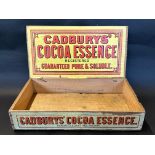 A Cadbury's Cocoa Essence counter top dispensing box with bright labels, 15 1/2" w.