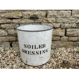 A large enamel pail bearing the words 'Soiled Dressing' 15" h x 15 1/2" diameter.