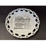 A porcelain ribbon plate bearing advertising for J. Wilson Pork Butcher of Preston, 7 1/2" diameter.