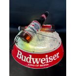 A Budweiser illuminated hanging pool table light formed as bottles of beer on ice, 24 1/2"