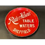 A circular enamel tray bearing advertising for Rider, Wilson's Table Waters of Sheffield, made by