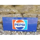 A tin sign advertising Pepsi, 21 1/2 x 9".