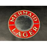 A small circular tin framed mirror advertising Mermaid Lager, 8" diameter.