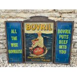 A Bovril pictorial tin advertising sign, framed in three parts, depicting a man clutching a jar of
