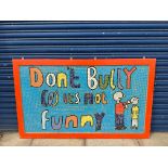 An unusual framed mosaic picture advertising the message 'Don't Bully cos it's not funny', 60 x