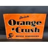 A rectangular tin sign advertising Orange Crush, 27 1/4 x 19 1/2".