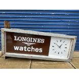 A large and rare wall mounted double sided clock lightbox advertising Longines watches, by repute