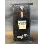 A circa 1930s Black Cat Dip 1/2d snuff vending machine of wooden construction, with key and