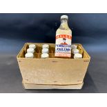 A box of 12 Chelsea Furniture Polish bottles.