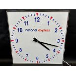 A wall hanging electric clock advertising National Express, 24 x 24".