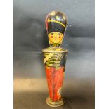 A Lyons' Assorted Toffee tin in the form of a soldier, 11" high.