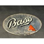 A small oval Bass advertising mirror, 9 x 6".