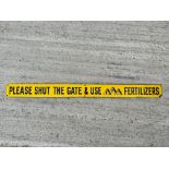 A 'Please Shut The Gate and use FPP Fertilizers' rectangular enamel sign, 36 x 3".