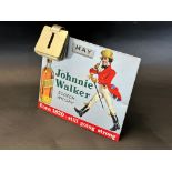 A desktop tin calendar advertising Johnnie Walker Scotch Whisky, 9 1/2" x 9".