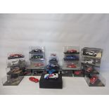 A selection of cased die-cast racing models to include Ferrari, Lotus and Aston Martin.