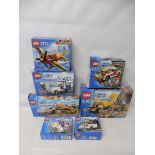 Seven boxed Lego City sets no.'s 4201, 60012, 7285, 60144, 3177, 60053 and 7235, not checked.