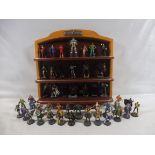 A large collection in four boxes of TV related figures etc to include a display shelf, magazines and