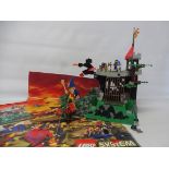 A Lego Dragon Knight's Fire Breathing Fortress, no. 6082, plus poster, not checked.