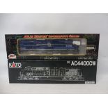 Two boxed locomotives, Atlas series B40B and Kato 37-64-34 Union Pacific.